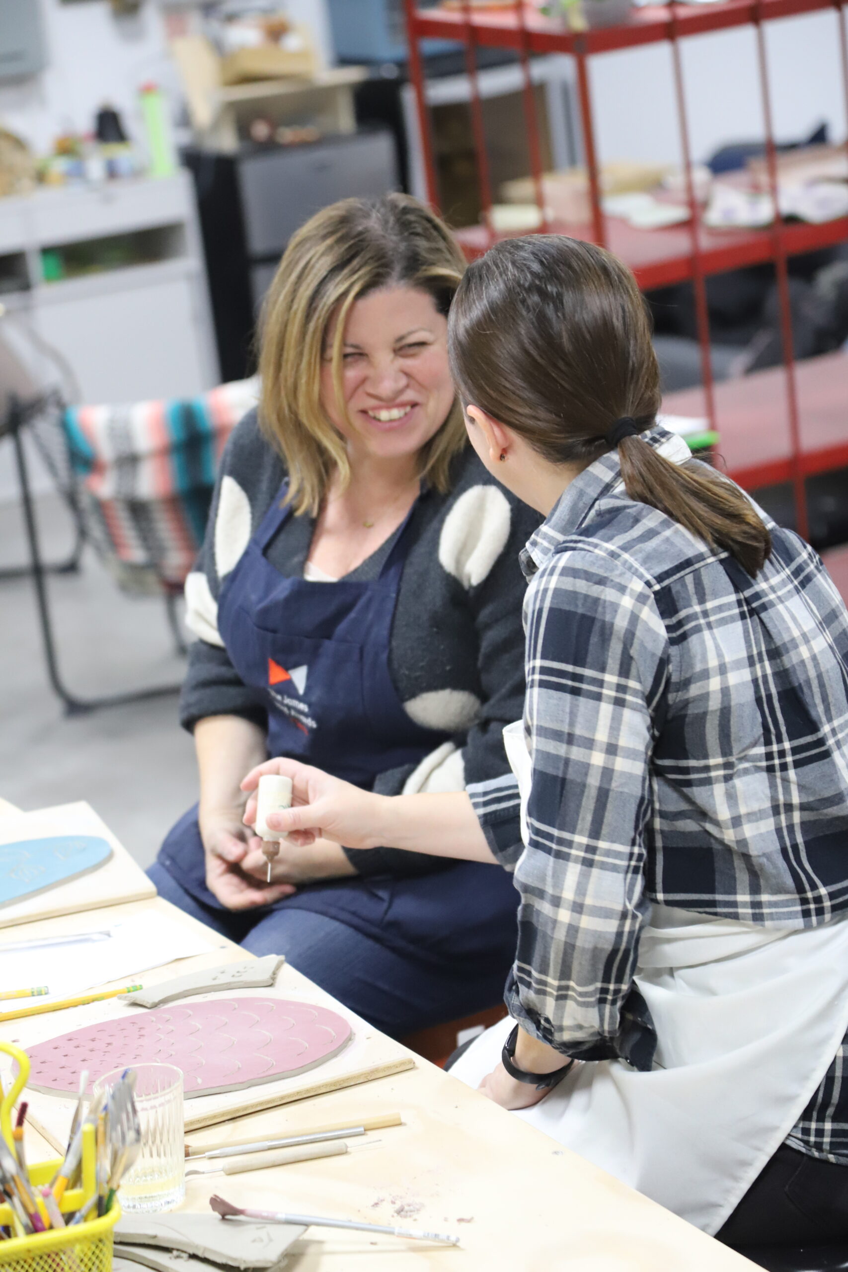Students in one-time pottery workshops at Slip Studio in White Plains NY in the heart of Westchester County NY