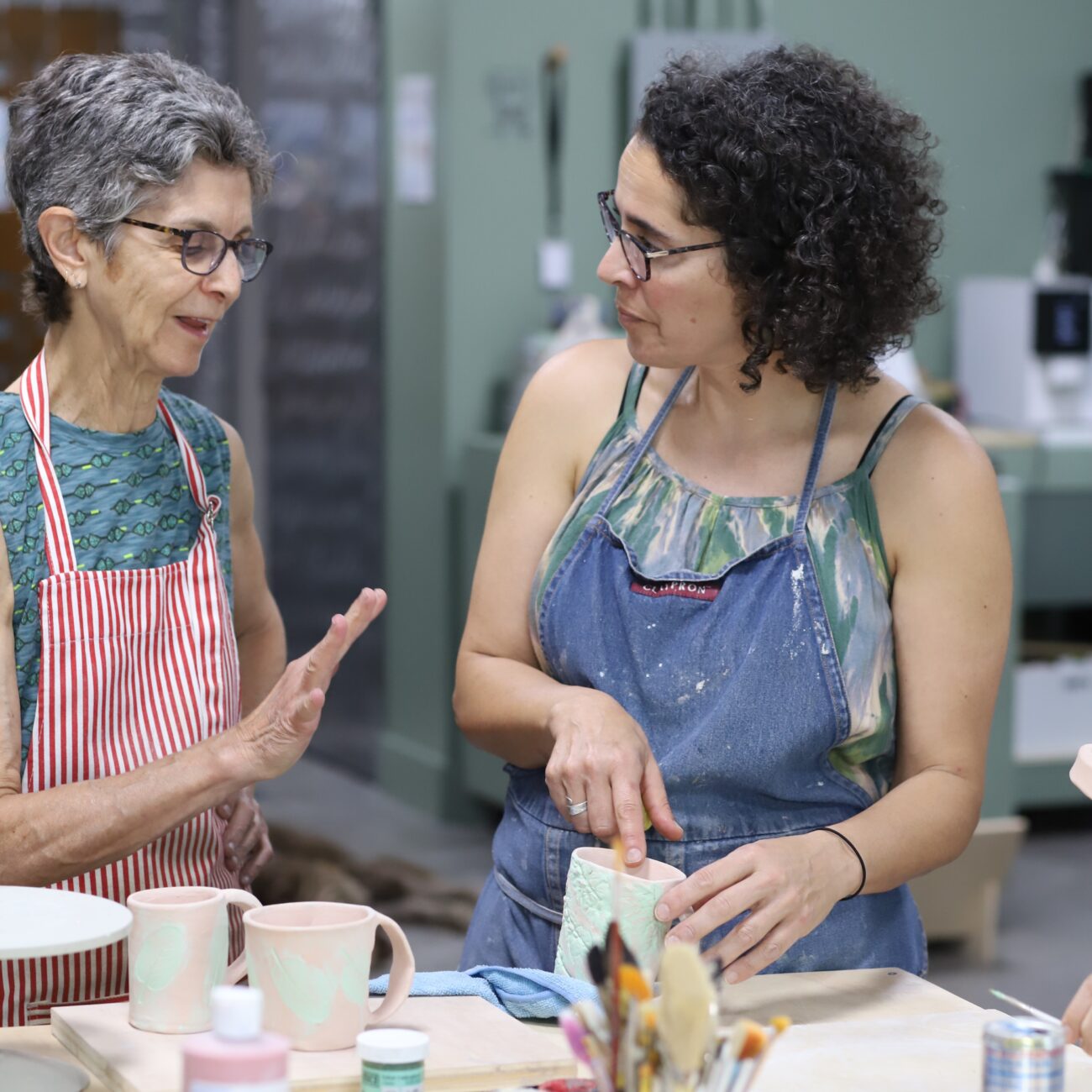 Ariella_working_with_student_at_slip_Studio