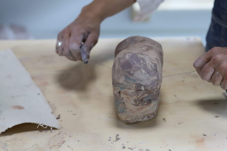 cutting Nerikomi clay with a wire tool